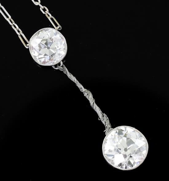 A 1930s/1940s white gold? and two stone diamond set drop pendant necklace (a.f.),